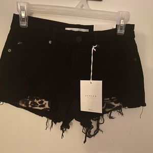 Kancan shorts. Size small. NWT. Black with leopard print pockets. Distressed.